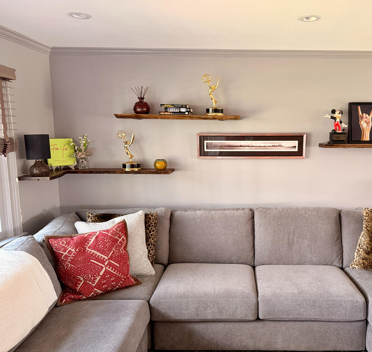 Walnut shelves above a couch
