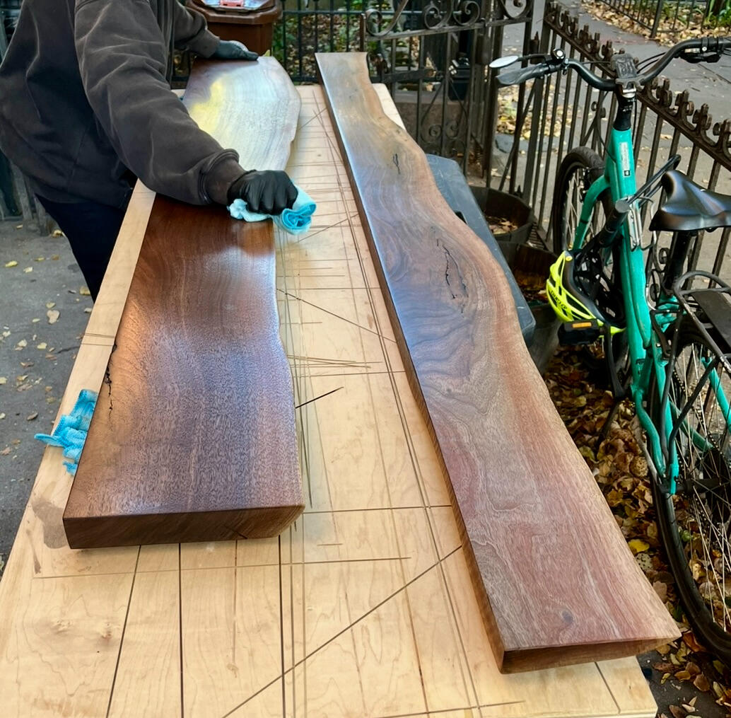 Walnut shelves being sanded Walnut shelves being sanded