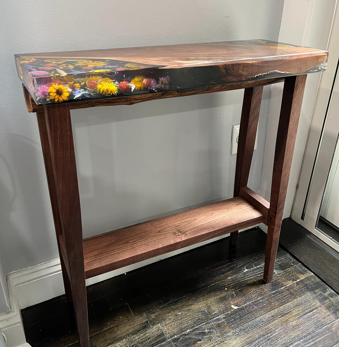 Black walnut console table with preserved flowers